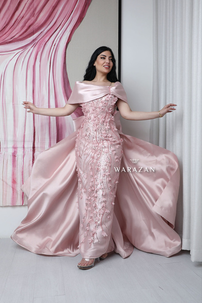 Warazan A soft, long floral evening dress with a bow at the back.