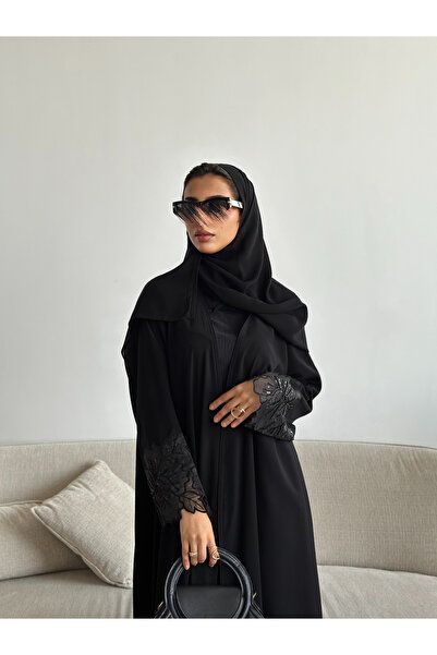 outline Black Eid abaya with a quarter-circle cut and black rose embroidery