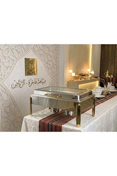 Afaq 9-liter hydraulic water heater, silver and gold combination.