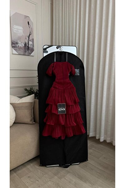 FASHION A bright red midi dress with a wavy layered design and bare shoulders...