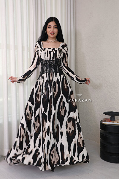 Warazan Elegant long evening dress with a zebra print Lace .
