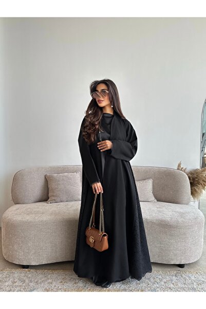 outline Black abaya with a full flared silhouette and lace embellishments – e...