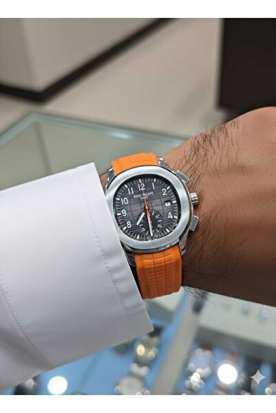 PATEKS A chronograph watch featuring a bold orange rubber strap.
