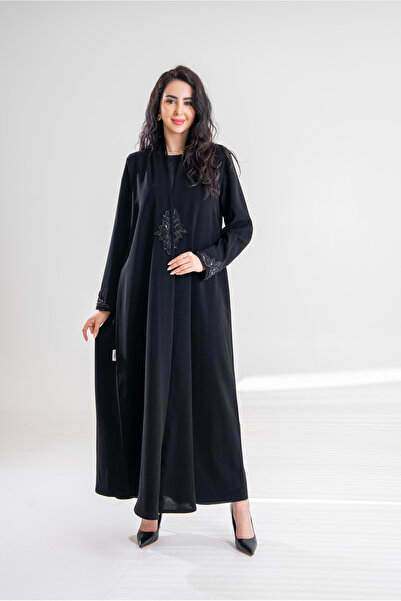 Al Afnan Boutique A luxurious abaya made of ceramic Crepe fabric with an eleg...