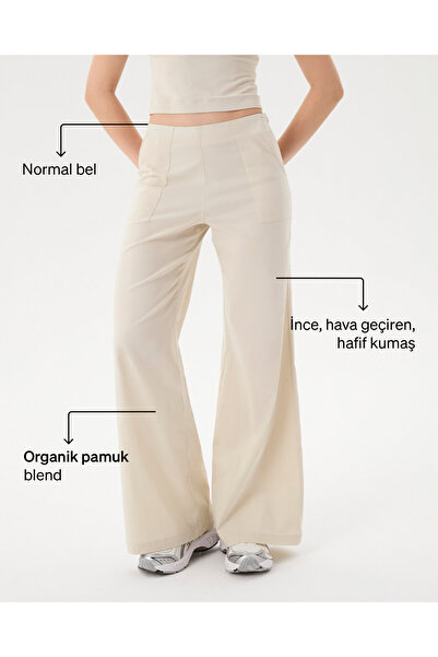 Ayma Active Γυναικείο παντελόνι σε κρεμ χρώμα, με κανονική μέση, φαρδιά μπατζ...