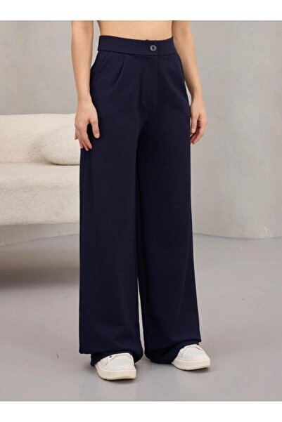 FLEX FASHION بنطلون نسائي قماش قابل للتمدد فضفاض واسع الساق بأزرار باللون الأ...