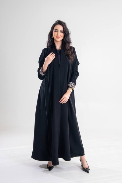 Al Afnan Boutique A distinctive abaya with a blazer cut, made from a unique, ...
