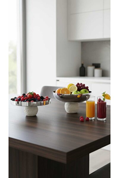 Generic A set of dessert and fruit serving dishes with a luxurious decorative...