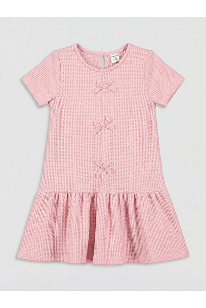 LC Waikiki Φόρεμα για κορίτσια με λεπτομέρεια φιόγκου και λαιμόκοψη ποδηλάτου...