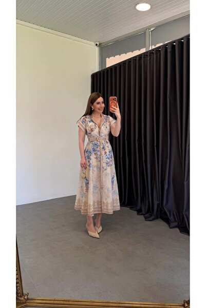 elif teke فستان أزرق مزين بالزهور وأزرار ذهبية باللون الأزرق