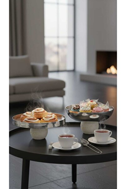 Generic A set of dessert and fruit serving dishes with a luxurious decorative...