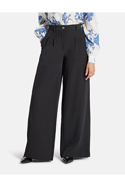 Guess بنطال قصة ساق واسعة بثنيات