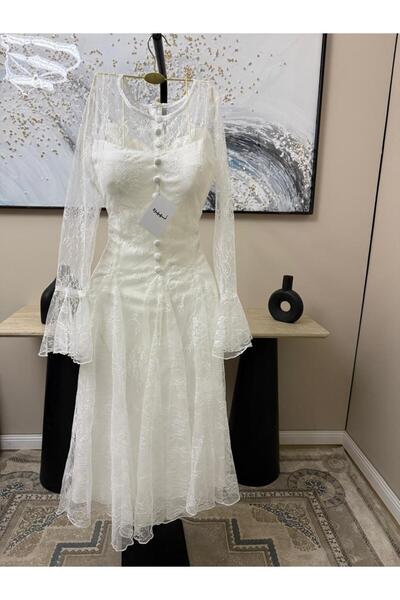 NUHAIRa "Lavender" dress with an off-the-shoulder design and a white color