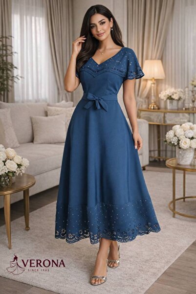 Verona A stylish midi dress with a defined waist and shimmering laser-cut det...