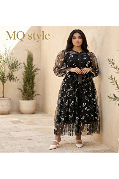 MQ The dress, a blend of modern elegance and classic touches from Style – the...