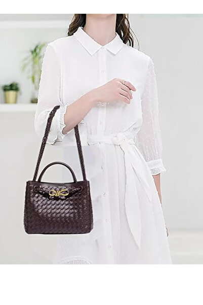 Bottega Venetta Iconic Intrecciato woven handbag with dark brown gold hardware.