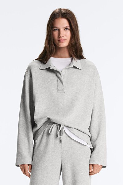 Oysho قميص بولو من قماش بيكي الممزوج