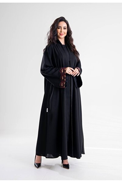 Al Afnan Boutique An abaya made of distinctive crepe fabric with an elegant t...