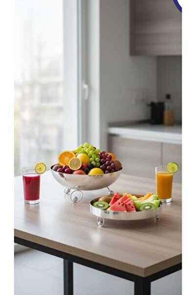 Generic A set of dessert and fruit serving dishes with a luxurious decorative...