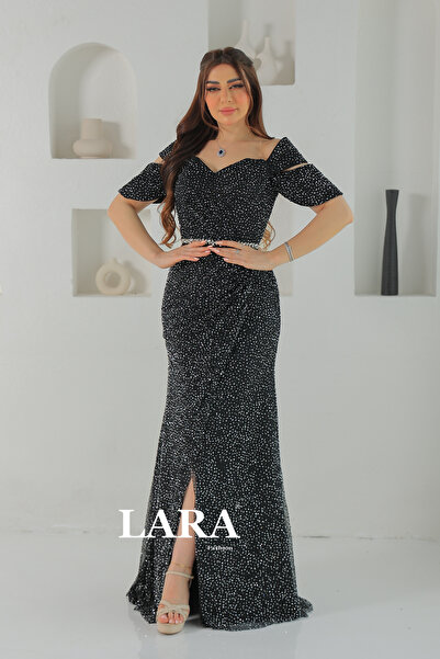 LARA.SA A shimmering black evening gown with an off-the-shoulder design and l...