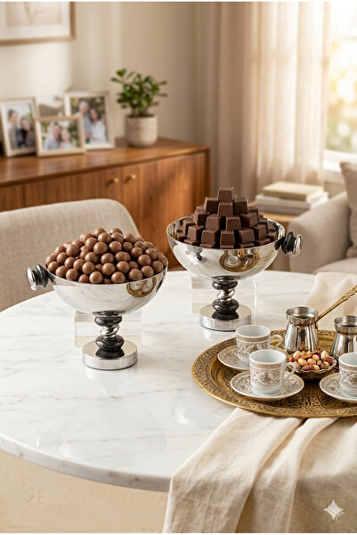 Generic A set of dessert and fruit serving dishes with a luxurious decorative...