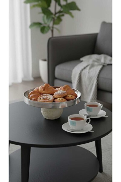 Generic A set of dessert and fruit serving dishes with a luxurious decorative...