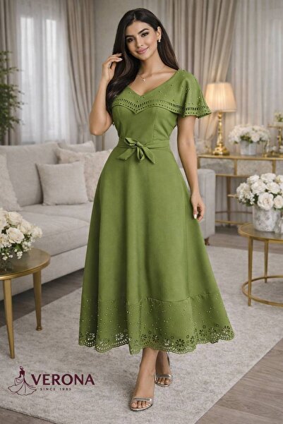 Verona A stylish midi dress with a defined waist and shimmering laser-cut det...