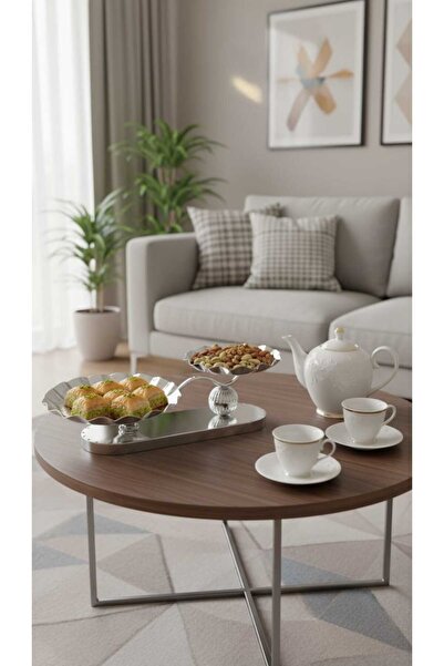 Generic A set of dessert and fruit serving dishes with a luxurious decorative...