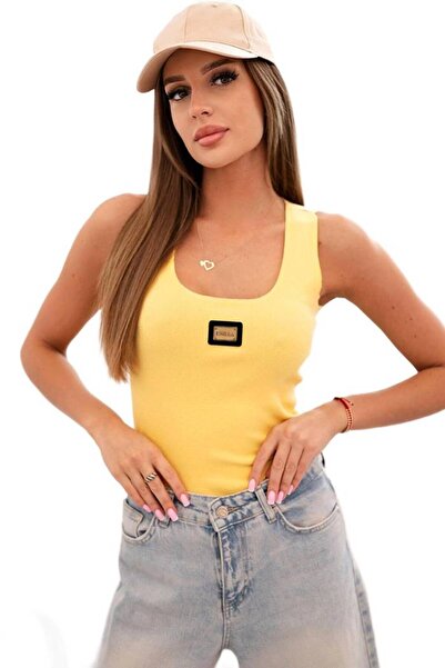 Kesi Dark yellow top for women with ribs, straps and appliqué
