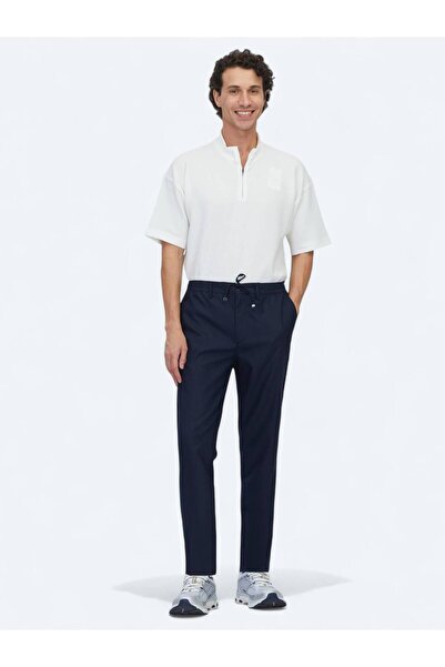 Kip Pantaloni casual de jogging cu țesătură uni albastru bleumarin