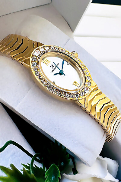 Daniel Klein ساعة يد نسائية أصلية ذات هيكل بيضاوي، سوار فولاذي ذهبي اللون مقا...