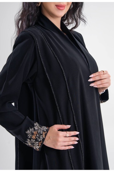 Al Afnan Boutique A distinctive abaya with a blazer cut, made from a unique, ...