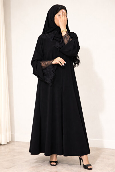 Elegant An elegant abaya made of crepe fabric, decorated with lace on the sle...