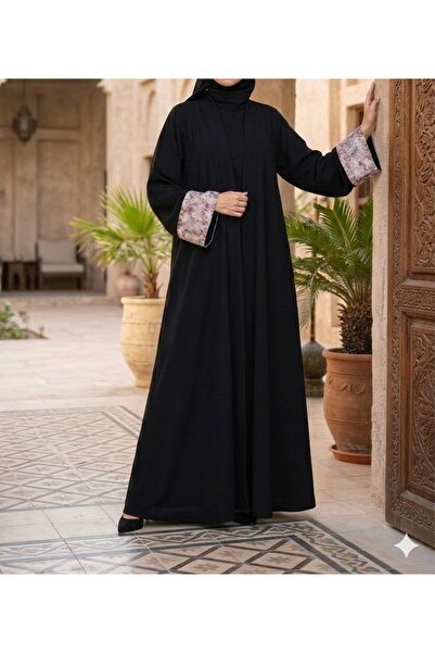 Omnia A luxurious black abaya with elegant details – understated elegance sui...