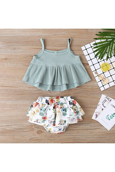 GENERAL A distinctive two-piece baby girl's set, suitable for ages 6 to 12 mo...