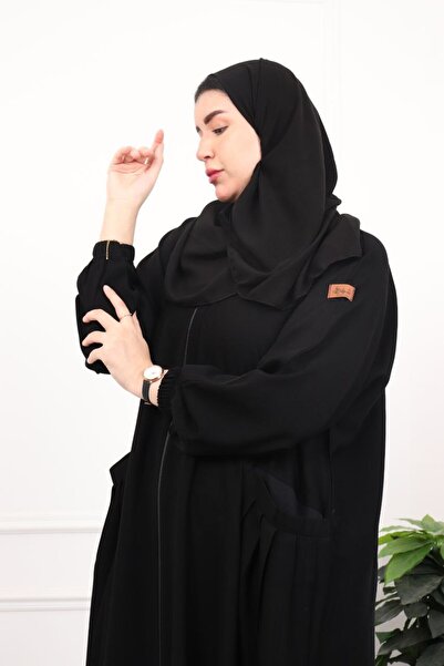 Elena Fatima Abaya – A wide black abaya with a full zipper and practical pock...