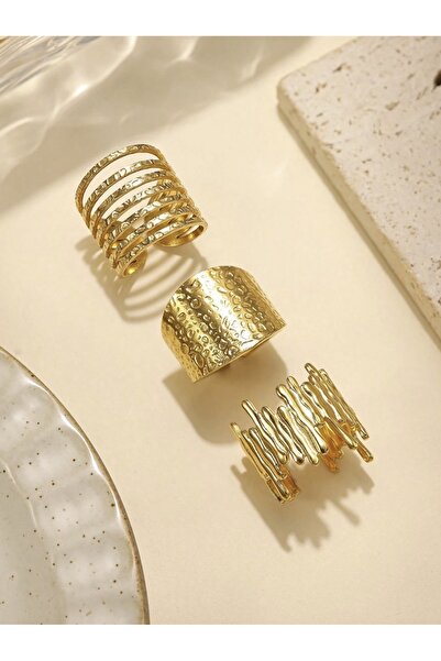 VEYA A set of 3 gold-plated rings with a bold, stacked polka dot design that ...
