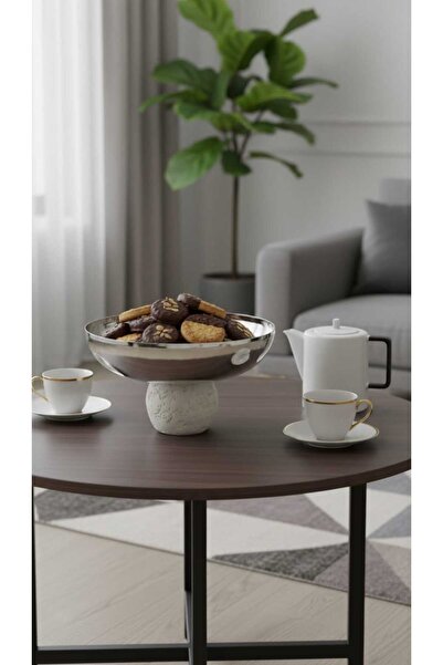 Generic A set of dessert and fruit serving dishes with a luxurious decorative...