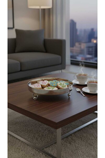 Generic A set of dessert and fruit serving dishes with a luxurious decorative...