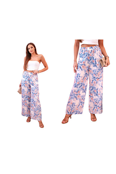 Kesi Niebieskie spodnie damskie szerokie w kwiaty z elastycznym pasem