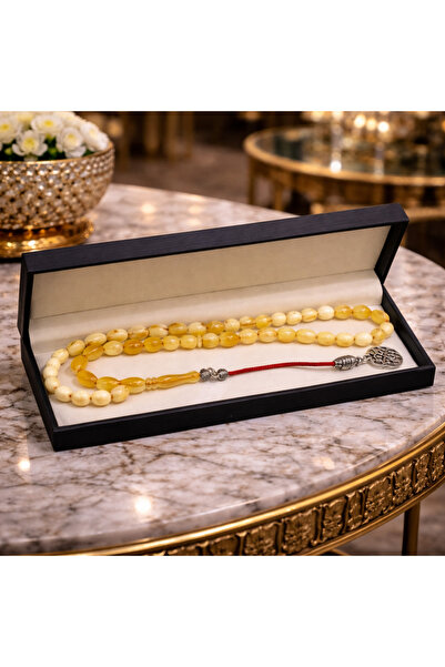 Generic A luxurious and elegant rosary in a yellow camouflage color, presente...