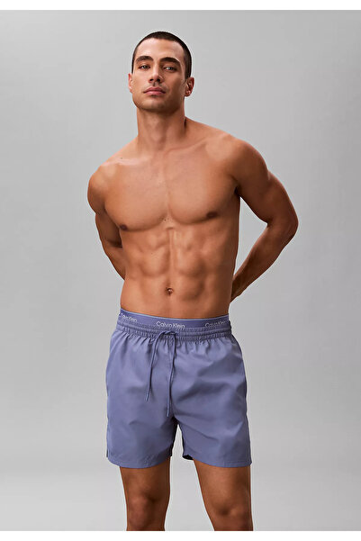 Calvin Klein Erkek Normal Kesim Hızlı Kuruyan Kumaşlı Lila Deniz Şortu LV00N6...