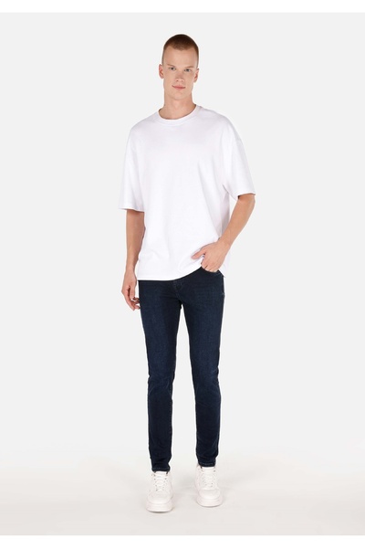 Colin's بنطال جينز ضيق بخصر منخفض للرجال من قماش الدنيم باللون الأزرق الداكن