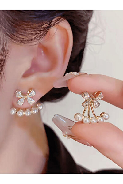 Take Two By Styli أقراط من اللؤلؤ الصناعي على شكل فيونكة