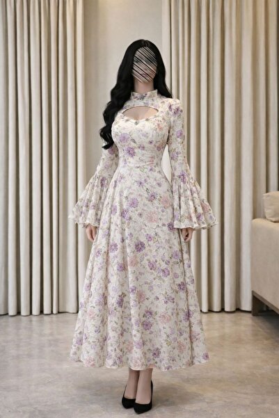 lisa فستان ربيعي ناعم مفعم بالأنوثة، يأتي بأرضية بيضاء مزينة بنقوش زهور البنفسج