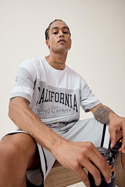 DeFacto Γρήγορου στεγνώματος oversized Φαρδιά μπλούζα με λαιμόκοψη με τύπωμα ...