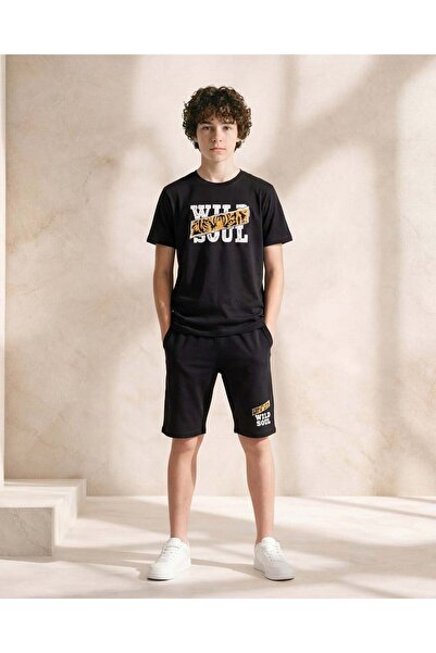 REDTAG طقم بيجاما أسود للأولاد الكبار من نوع وايلد سول