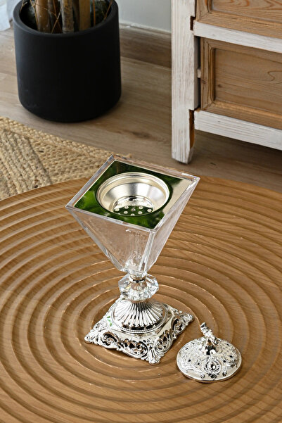 SQUALO A transparent glass incense burner with an ornate silver base – transp...