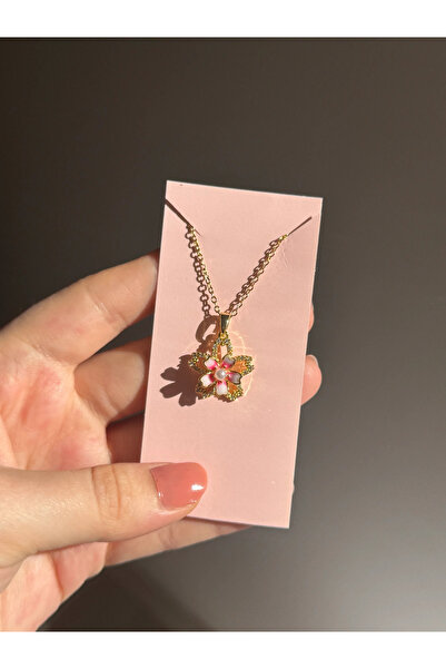 Harlofia Jewelry قلادة زهرة الزنبق الفولاذية القابلة للدوران 360 درجة