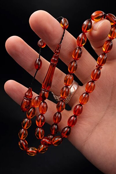 Cemhan Göksal سبحة من حجر العنبر الناري مقاس 8×11 ملم، مصنوعة يدويًا بتصميم خ...